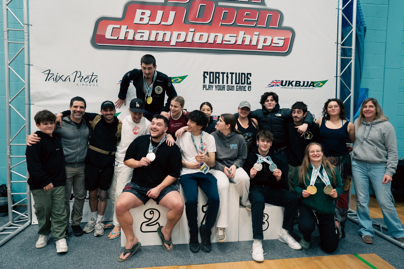 The Grow team celebrating with medals at the BJJ Open Championships
